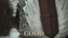 a close up of a person 's head with the word good written on it