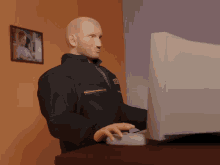 a man wearing a jacket that says ' dhl ' on it is typing on a keyboard