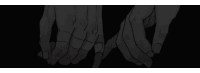 a black and white drawing of two hands holding each other in the dark .