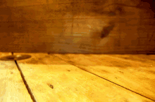 a wooden table with a candle on it