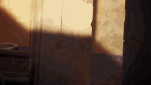 a shadow of a person is cast on a wall behind a door