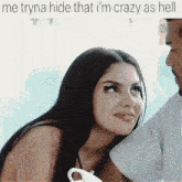 a woman is looking at a man with the caption " me tryna hide that i 'm crazy as hell "