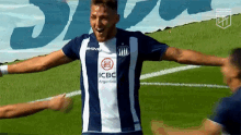 a soccer player wearing a jersey that says icbc