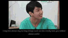a man in a green shirt is smiling and talking to someone
