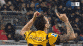 a soccer player with the name calhanoglu on his shirt