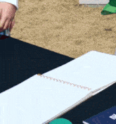 a person 's hand is holding a piece of paper that says ' i 'm sorry '