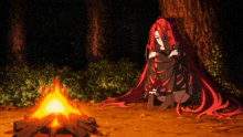 a woman with red hair sits next to a fire