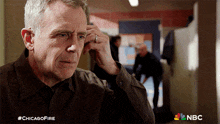 Removing The Earbuds Hank Voight GIF - Removing The Earbuds Hank Voight Chicago Fire GIFs