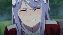a close up of a girl 's face with tears running down her cheeks