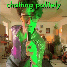 a man singing into a microphone with the words " chatting politely " behind him