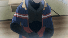 a person wearing a blue jacket with red white and black stripes