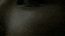 a close up of a person 's face in the dark