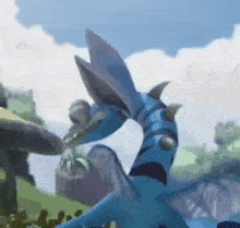 a blue dragon with horns is eating a frog in a painting .