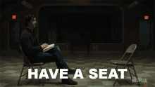 Have A Seat Father Paul GIF - Have A Seat Father Paul Hamish Linklater GIFs