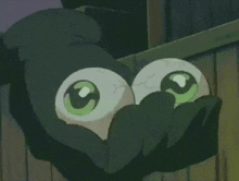 a close up of a person 's face with two green eyes