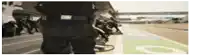 a blurred image of a person wearing a black omp uniform