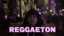 a woman in a black hoodie says reggaeton