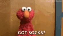 Elmo Shrug GIF - Elmo Shrug Got Socks GIFs
