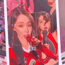 a picture of a woman singing into a microphone with korean writing