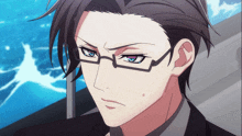 a close up of a person wearing glasses and a black suit