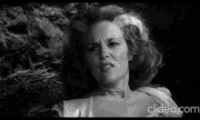 a black and white photo of a woman with the website clideo.com in the lower right corner