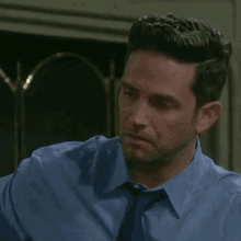 a man is covering his mouth with his hands