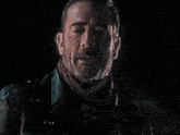 a man with a beard wearing a leather jacket
