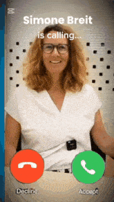 a woman is talking on a phone with the name simone breit
