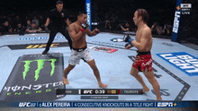 two men are fighting in a boxing ring with a monster energy advertisement in the background