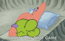 patrick star from spongebob squarepants is laying on a bed with a pillow .