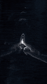 a person 's hand is pointing at a futuristic screen with a circle that says ' a ' on it