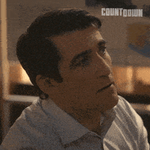 a man says keep on going with a countdown logo behind him