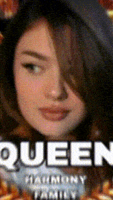 a close up of a woman 's face with the word queen written on it