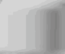 a smiley face is drawn on a white surface