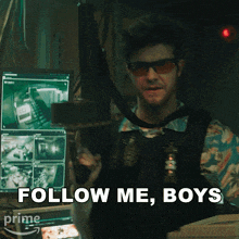 a man holding a gun with the words follow me boys behind him