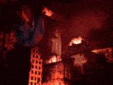 a painting of a burning city with a purple background