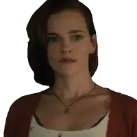 a woman wearing a red cardigan and a necklace with a medallion on it