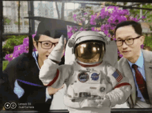 a lenovo s5 dual camera shows a man in a nasa astronaut costume