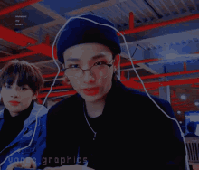 a boy wearing glasses and a blue hat has the word vince graphics on the bottom