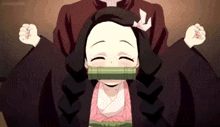 a little girl is sitting on a man 's lap with her eyes closed .