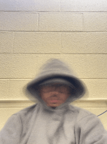 a blurry photo of a person wearing a hoodie