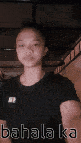 a young man is wearing a black shirt that says ' am2 ' on it