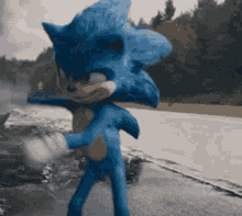 a blue sonic the hedgehog is standing on a road