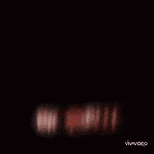 a blurry picture of a woman 's face with the words vimvideo on the bottom right