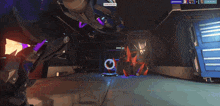 a video game screen shows a robot with purple lights and the words contested on the bottom
