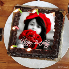 a chocolate birthday cake with a picture of a girl on it