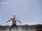 a man in a red and white suit is standing in front of a blue sky with the word ultraman on it