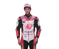 a man wearing a red bull hat and a honda racing suit
