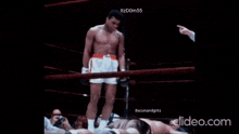 a man in a boxing ring with the words baconandgrits on the bottom right