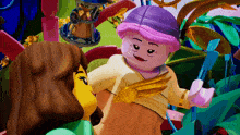 a lego girl with a purple hat and wings is standing next to another girl